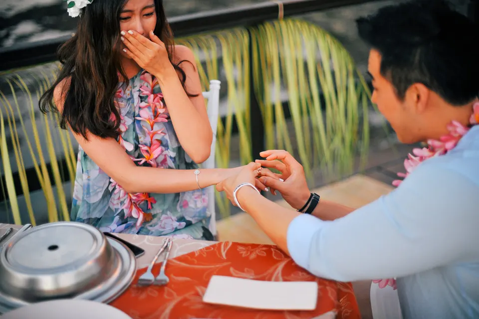 Engagement ring exchange by the sea