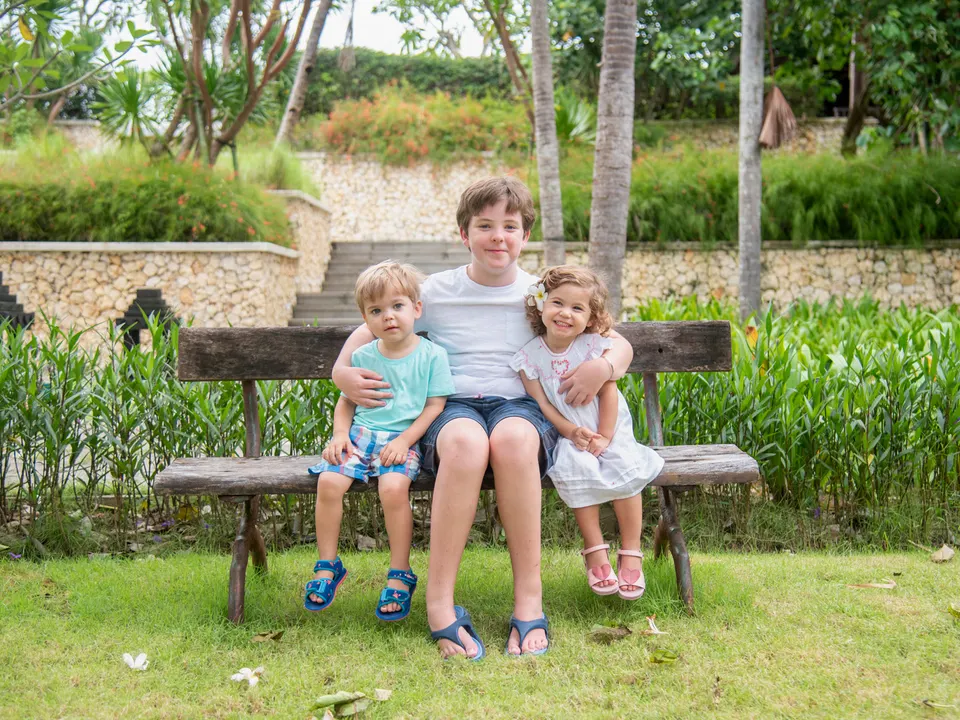 Children together in a tropical garden