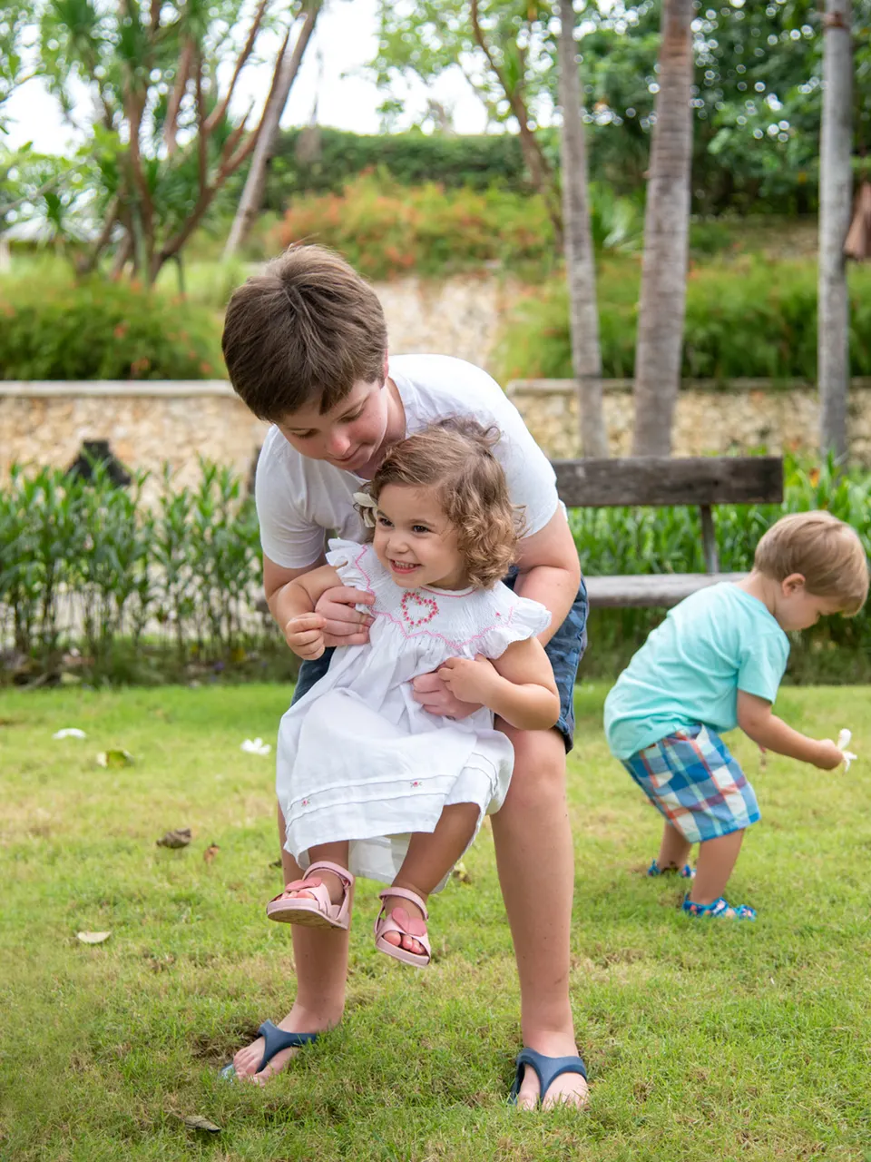 Children together in a tropical garden