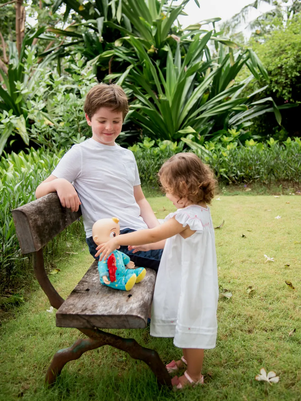 Children together in a tropical garden